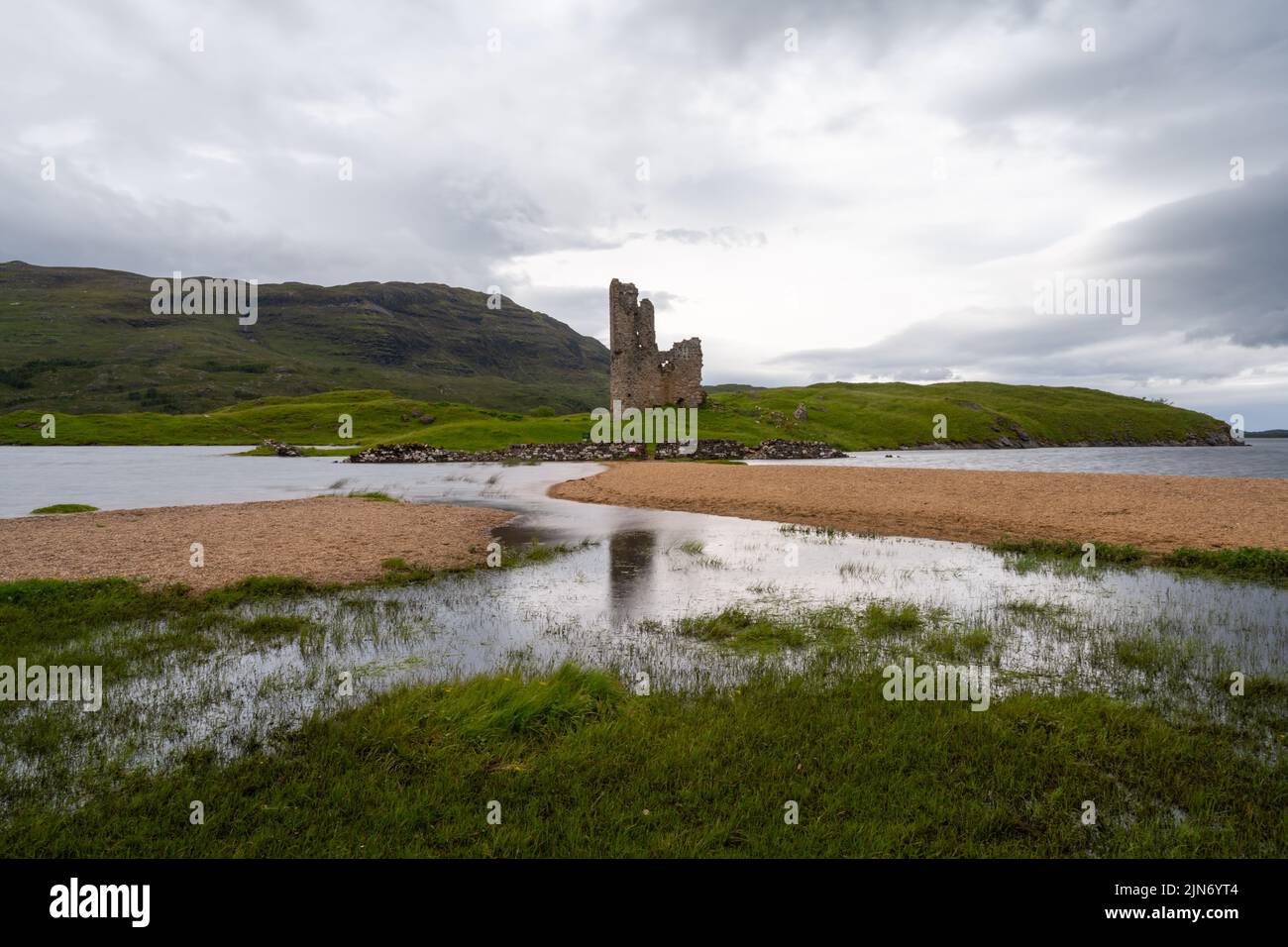 Inchnadamph, United Kingdom - 28 June, 2022: long exposure view of the Ardvreck Castle on Loch Assynt in the Scottish Highlands Stock Photo