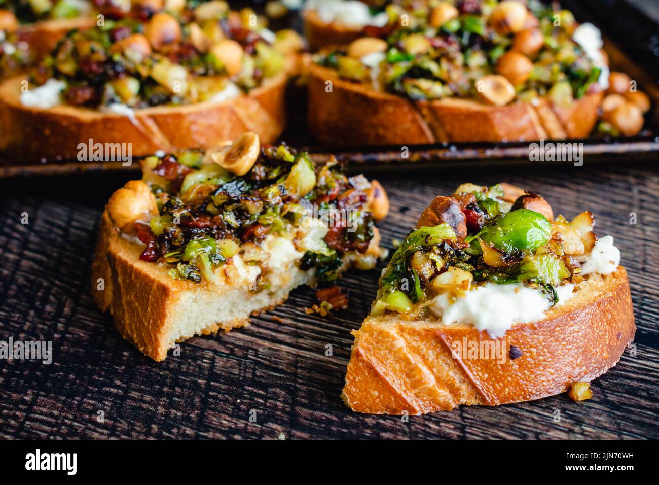 Caramelized Brussels Sprout Toast with Burrata & Bacon Side view of toasted bread topped with