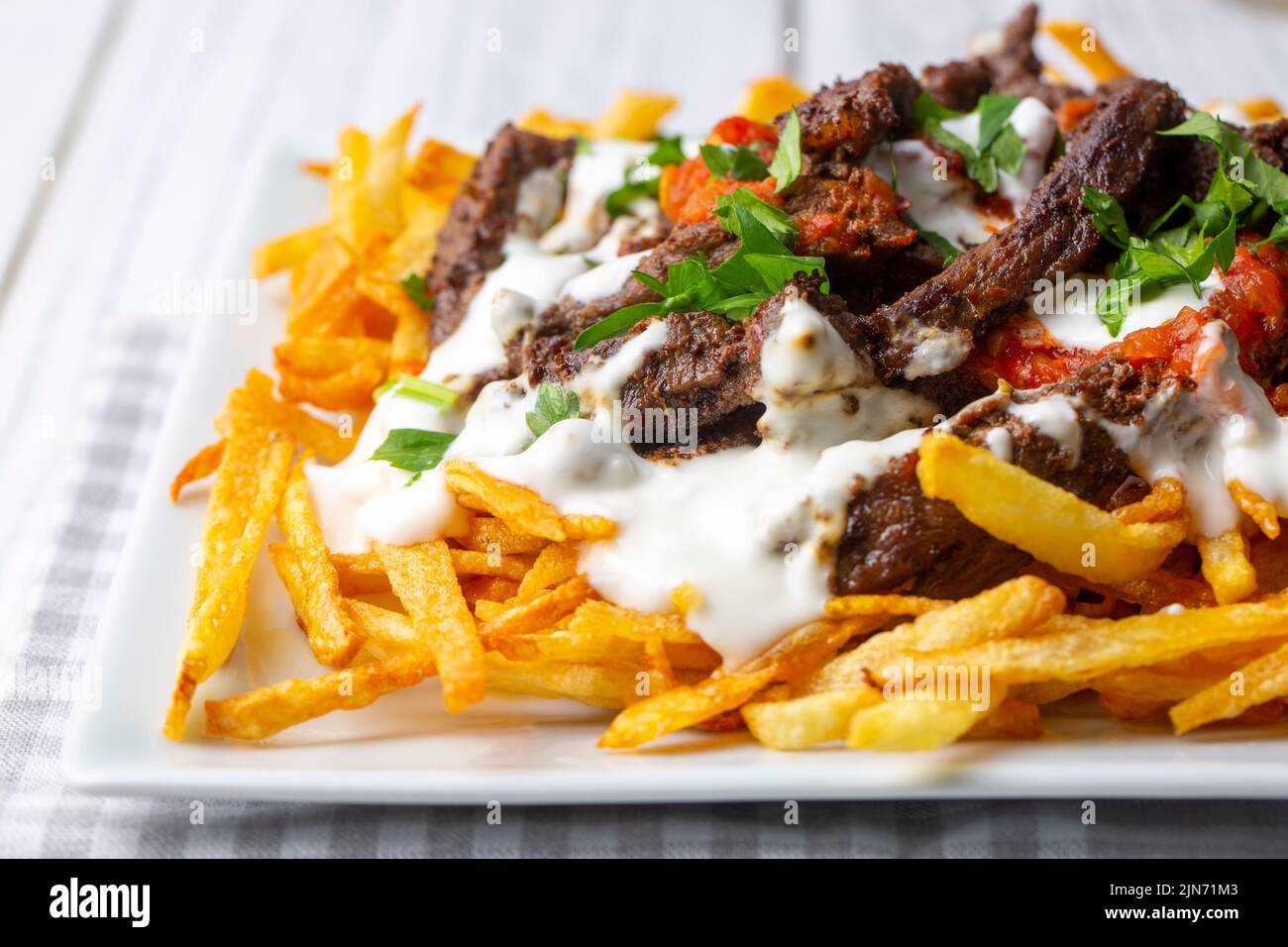 Turkish food; Cokertme Kebab Beef meat kebab with yoghurt and french