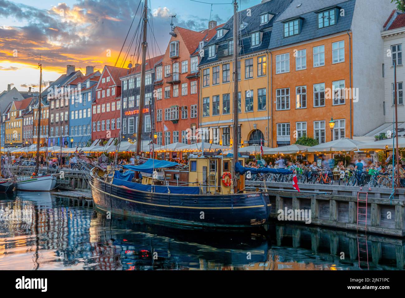 A beautiful shot of a famous tourist spot Nyhavn in Copenhagen with colorful buildings and boats Stock Photo