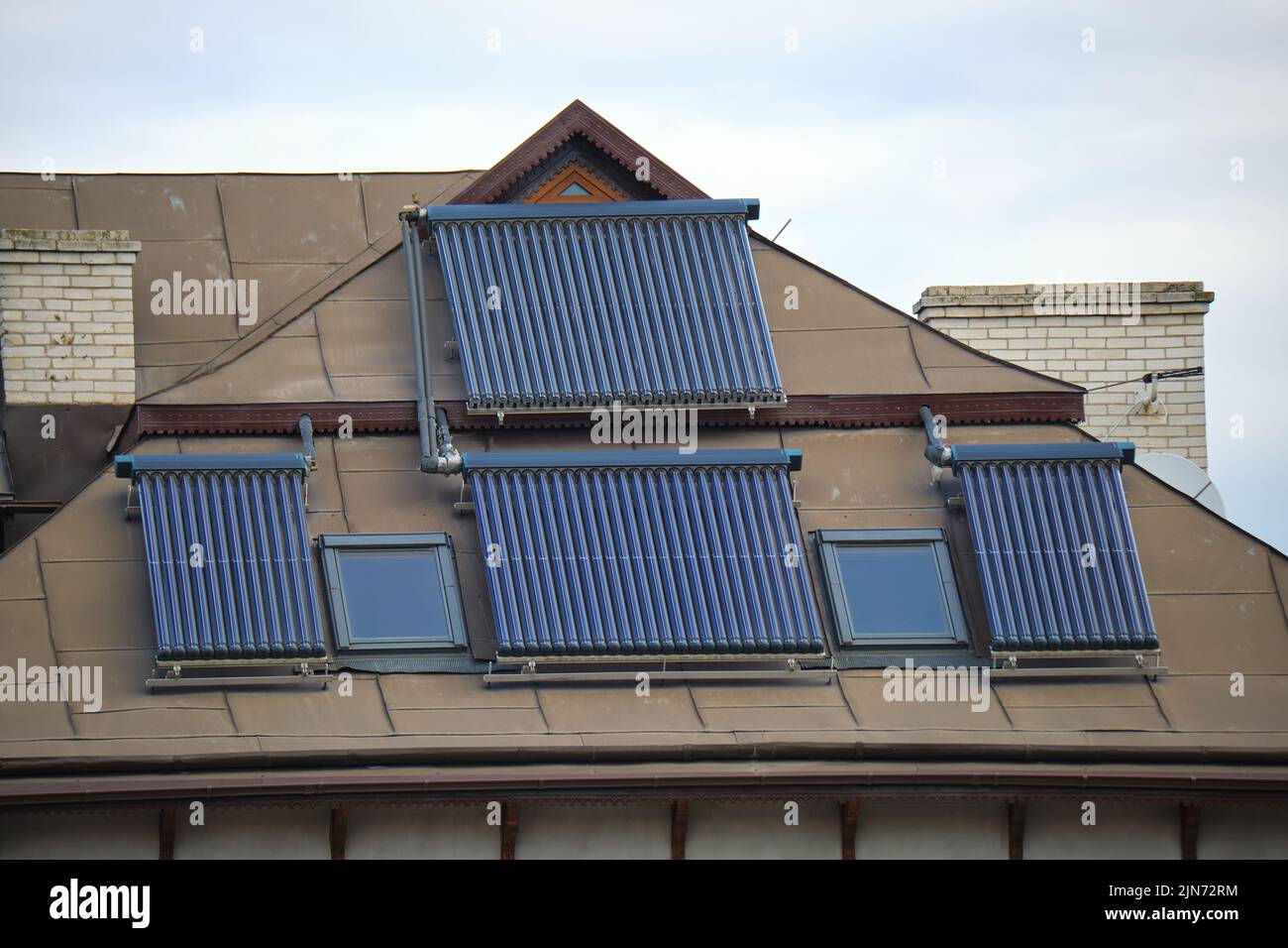 Building roof with rows of vacuum air solar collectors for water ...