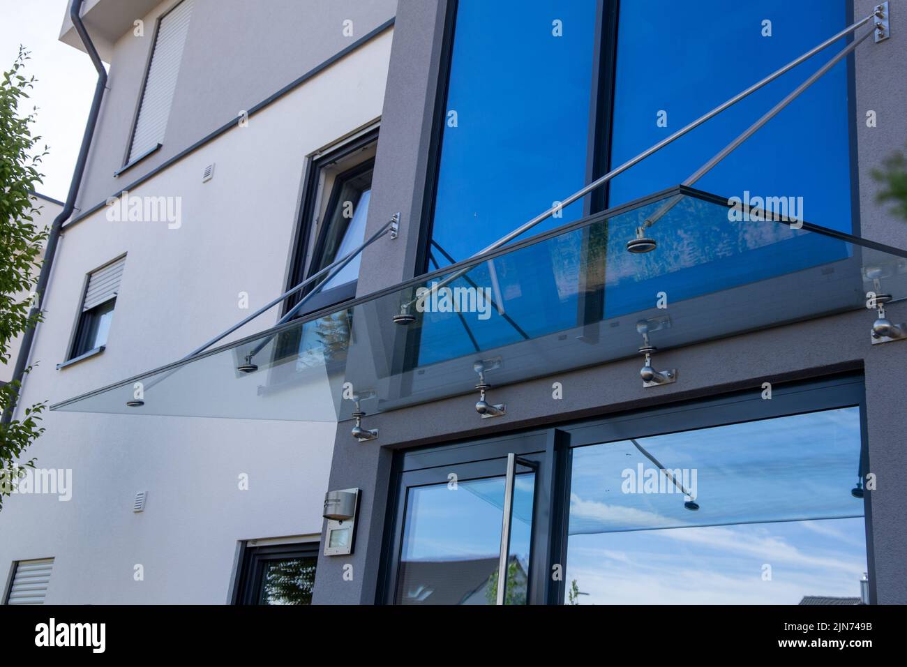 New glass canopy on a residential building Stock Photo