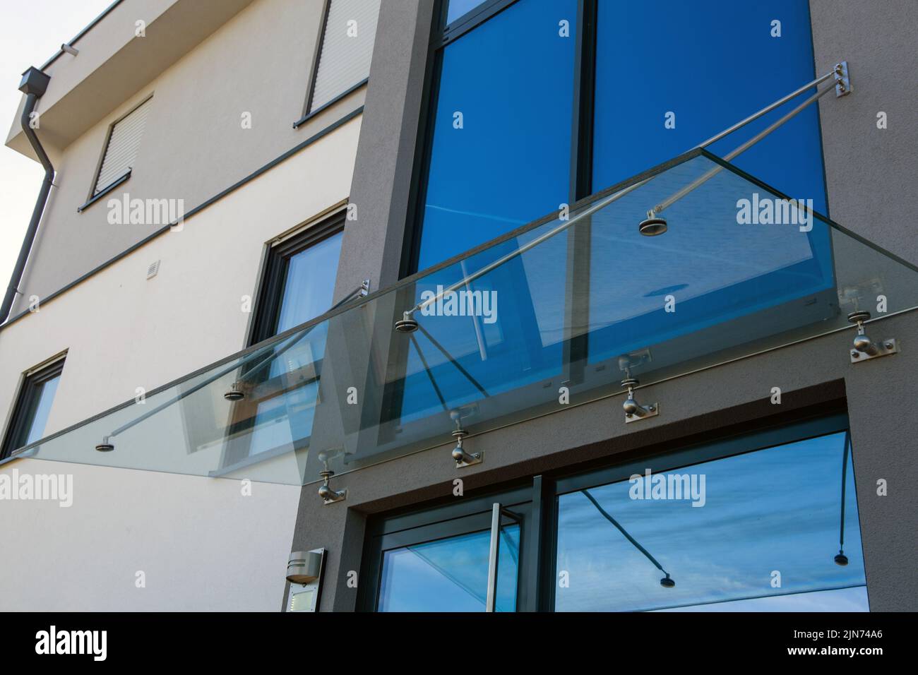 New glass canopy on a residential building Stock Photo