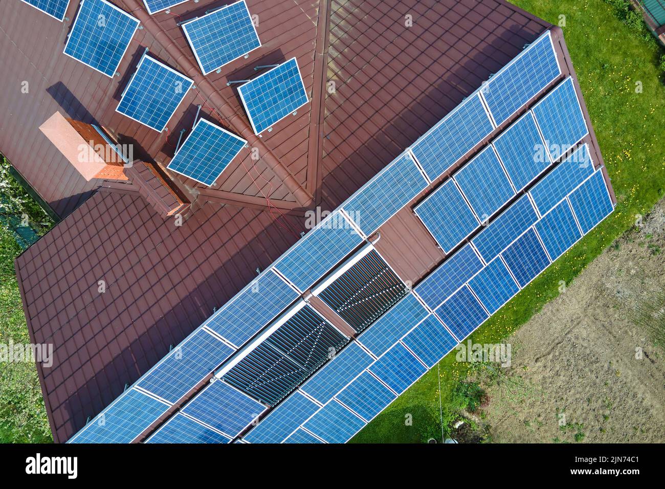 Private home roof covered with solar photovoltaic panels for generating ...