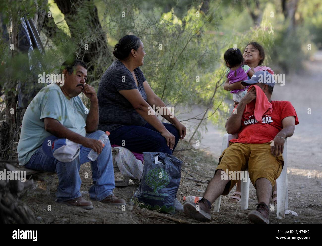 Relatives of trapped miners wait for news about their loved ones outside the facilities of a coal mine, where a mine shaft collapsed leaving miners trapped, in Sabinas, Coahuila state, Mexico, August 9, 2022. REUTERS/Luis Cortes Stock Photo