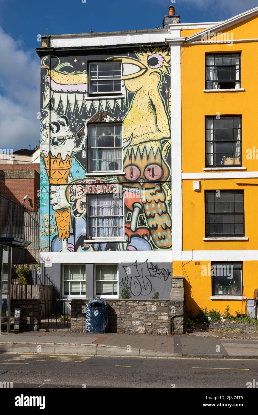 Contemporary Street Art - urban graffiti on the wall of a house in Stokes Croft, Bristol, England, UK Stock Photo