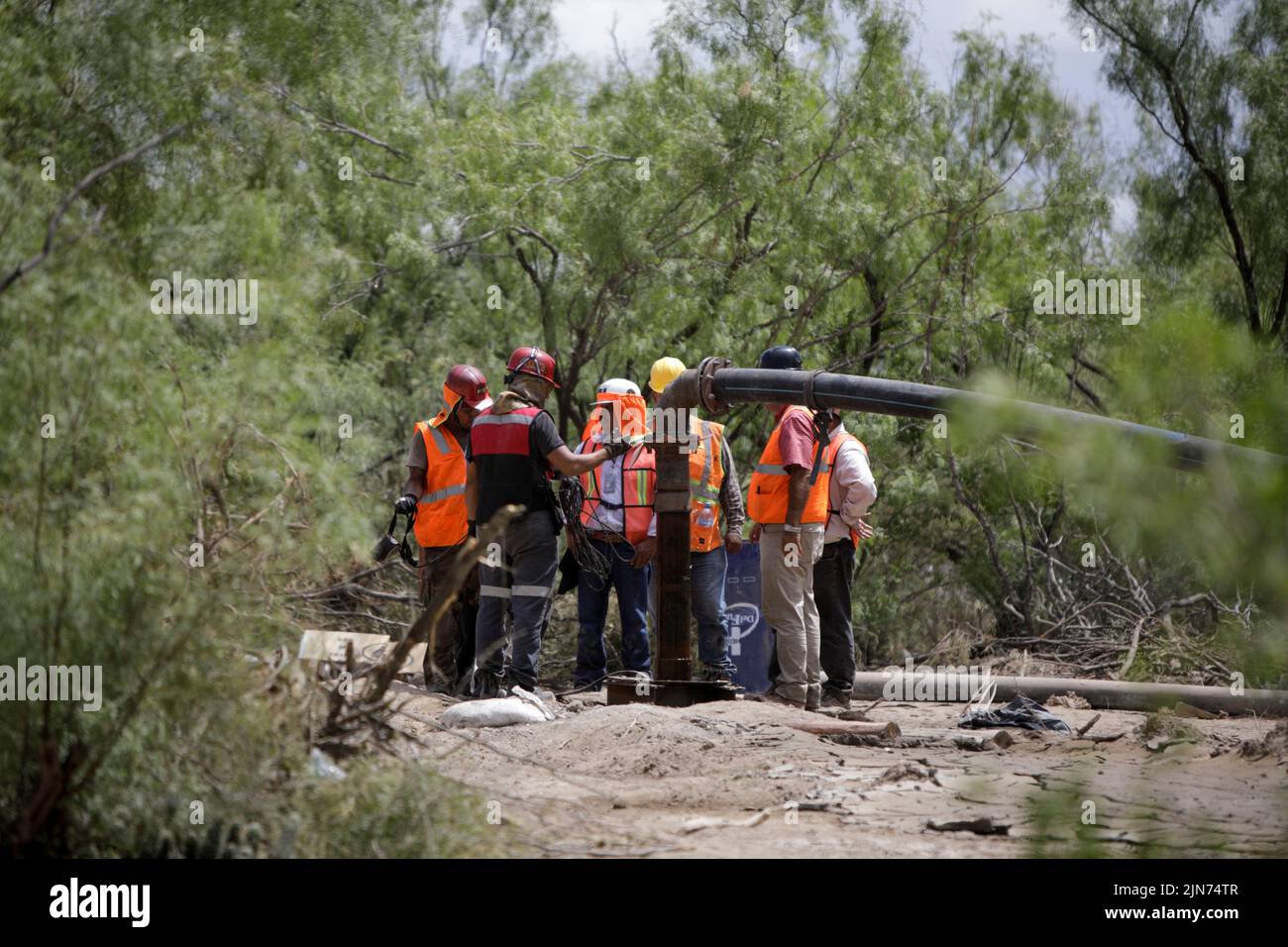 Workers participate in the rescue operation for miners trapped in a coal mine that collapsed in Sabinas, in Coahuila state, Mexico, August 9, 2022. REUTERS/Luis Cortes Stock Photo