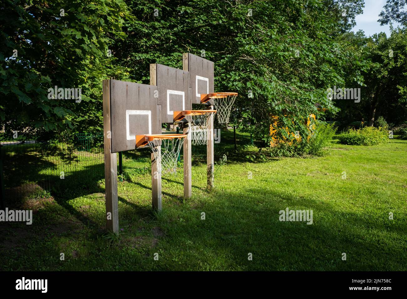 Three basketball hoops on different heights for children in