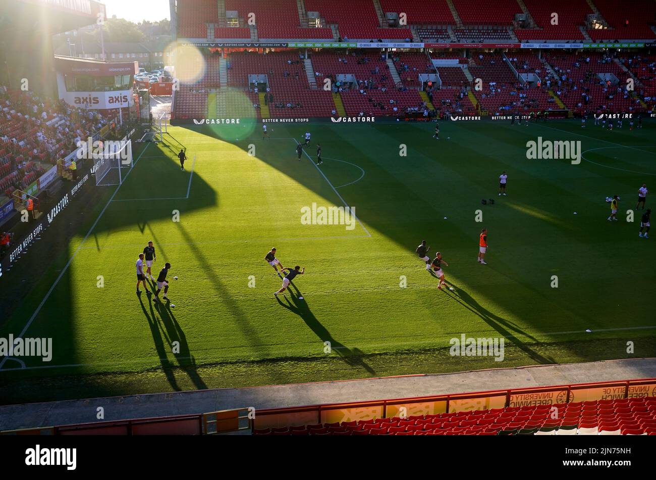Queens Park Rangers players warm up on the pitch ahead of the Carabao Cup, first round match at The Valley, London. Picture date: Tuesday August 9, 2022. Stock Photo