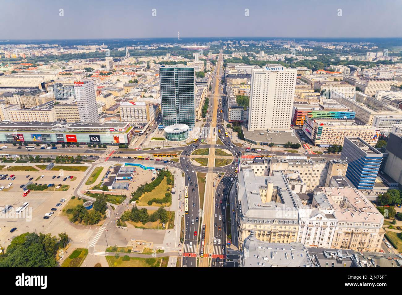 7.22.2022 Warsaw, Poland. Sunny aerial panoramic shot of centre of Warsaw. Roman Dmowski roundabout. Nearby department stores. Hotels in Neo-Baroque Architecture. High quality photo Stock Photo