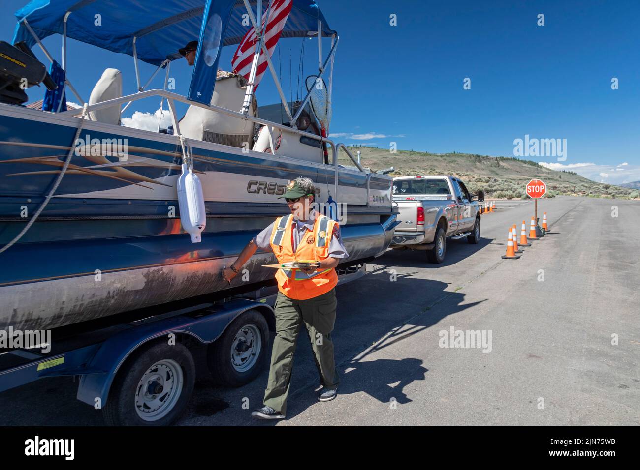 Gunnison, Colorado - Carol Soell, a boat inspector at Curecanti National Recreation Area, checks boats entering and leaving Blue Mesa Reservoir for in Stock Photo