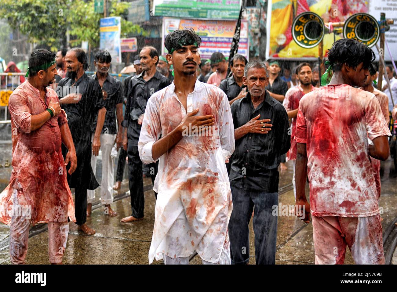 (EDITORS NOTE: Image contains graphic content.) Shi'ite Muslims covered in blood beat their chests and heads with blades during the Muharram procession of Kolkata. Muharram is the first month of the Islamic calendar & Ashura is the tenth day of the month of Muharram on which the commemoration of the martyrdom of Imam Hussain, the grandson of Prophet Muhammad (PBUH), during the battle of Karbala, is done. It is part of Mourning for Shia Muslims and a day of fasting for Sunni Muslims that is observed all over the World. Stock Photo