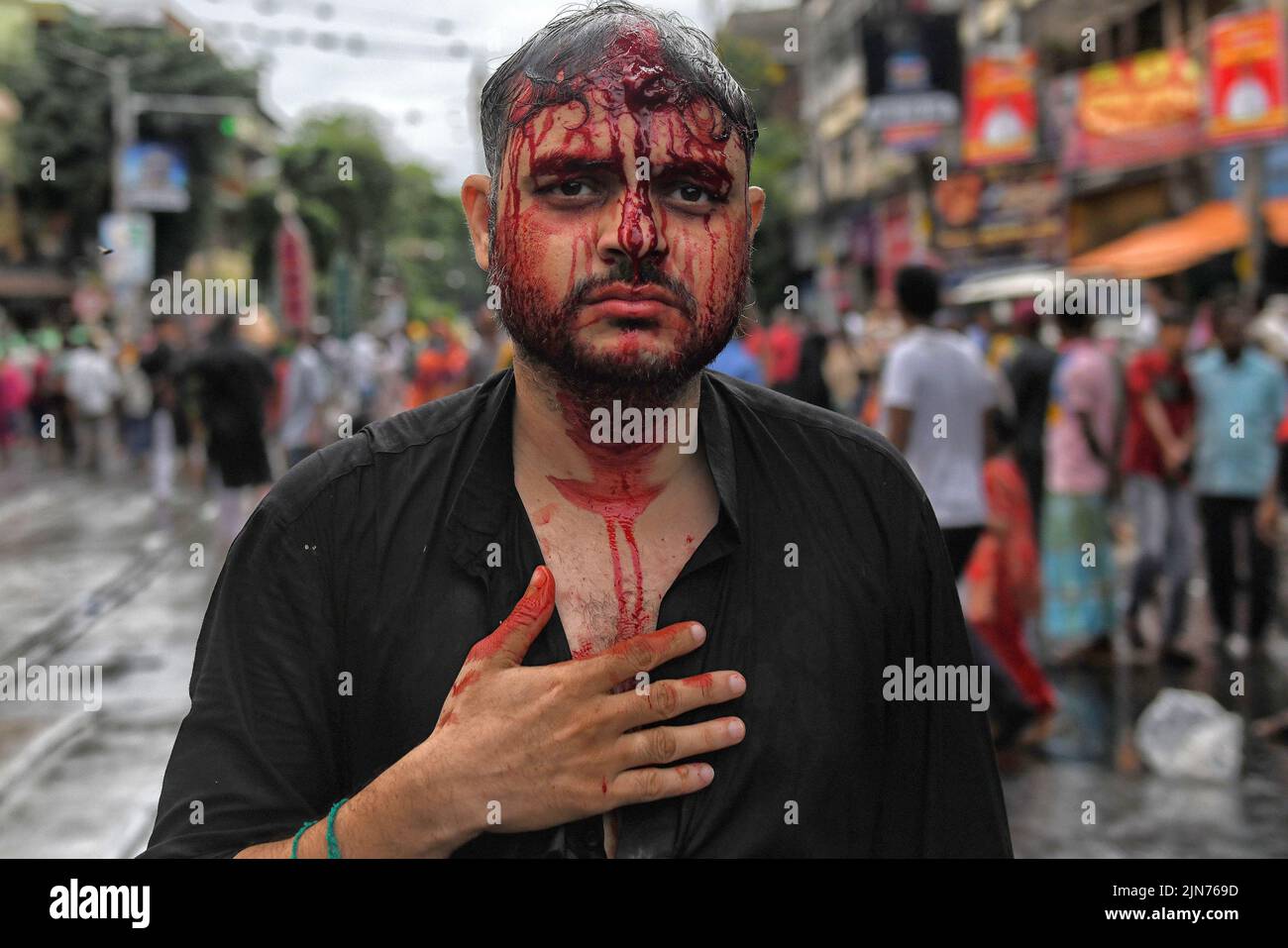 (EDITORS NOTE: Image contains graphic content.) A Shia Muslim devotee seen covered in blood after dangerously wounding himself with blades while showing his grief during the Muharram procession of Kolkata. Muharram is the first month of the Islamic calendar & Ashura is the tenth day of the month of Muharram on which the commemoration of the martyrdom of Imam Hussain, the grandson of Prophet Muhammad (PBUH), during the battle of Karbala, is done. It is part of Mourning for Shia Muslims and a day of fasting for Sunni Muslims that is observed all over the World. Stock Photo