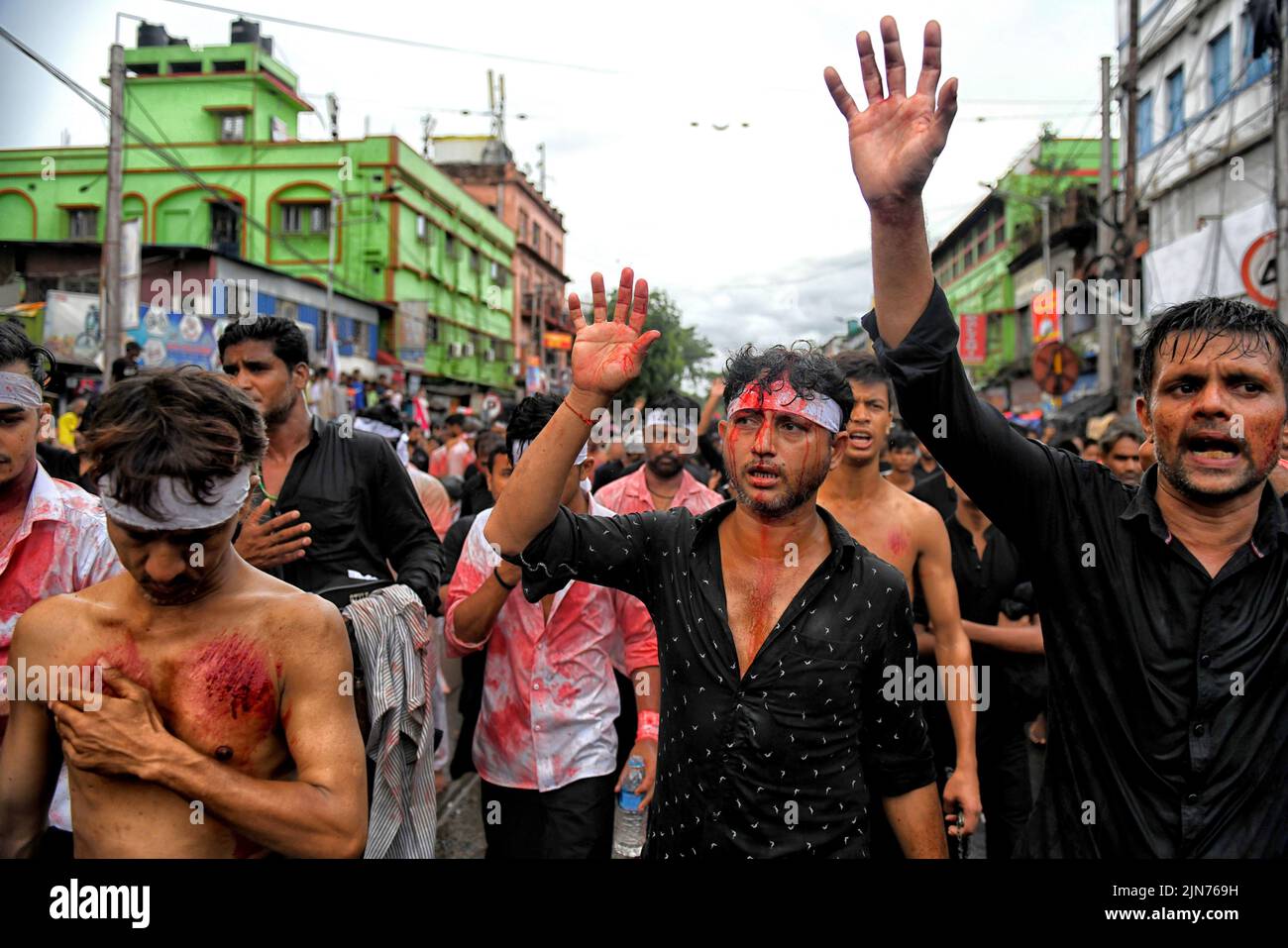 (EDITORS NOTE: Image contains graphic content.) Shi'ite Muslims covered in blood beat their chests and heads with blades & swords during the Muharram procession of Kolkata. Muharram is the first month of the Islamic calendar & Ashura is the tenth day of the month of Muharram on which the commemoration of the martyrdom of Imam Hussain, the grandson of Prophet Muhammad (PBUH), during the battle of Karbala, is done. It is part of Mourning for Shia Muslims and a day of fasting for Sunni Muslims that is observed all over the World. Stock Photo