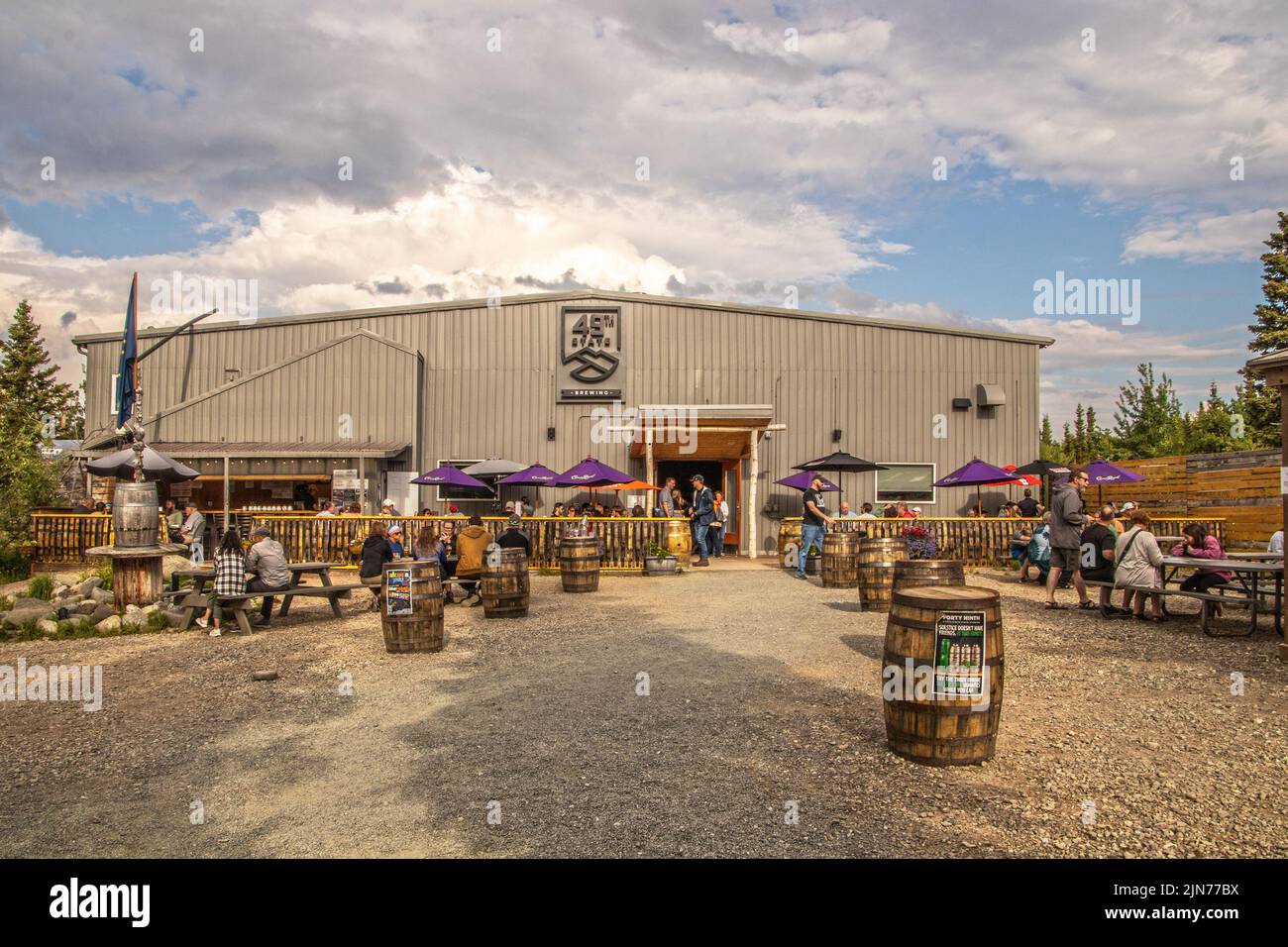 2022  06 22 Healy AK USA - Front view of 49th State Brewing - a popular resturant and brewery near Denali Alaska with customers sitting at outside tab Stock Photo