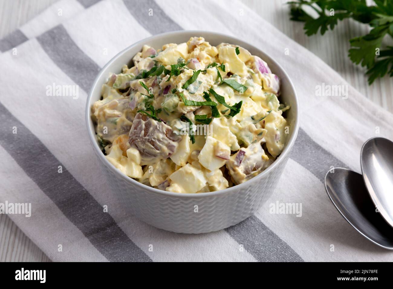 Homemade Healthy Potato Salad with Eggs in a Bowl, side view Stock