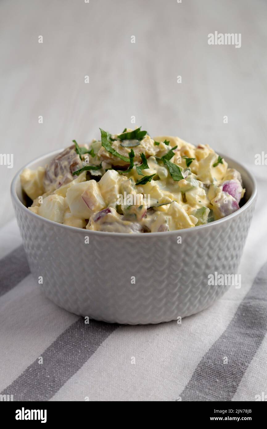 Homemade Healthy Potato Salad with Eggs in a Bowl, side view Stock