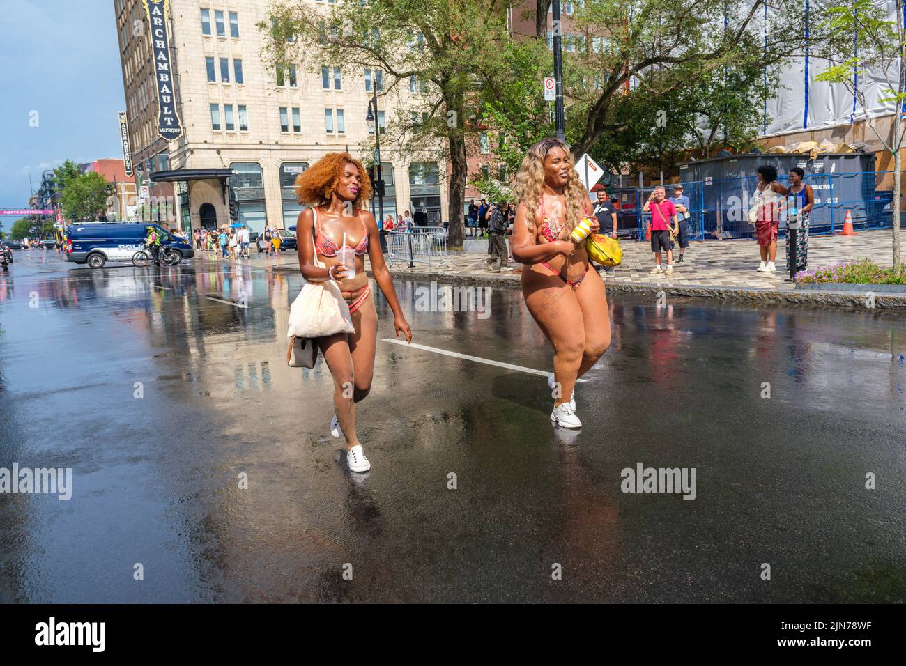 Montreal, CA - 7 August 2022: Two people take part in spontaneous gay pride march after official pride parade was cancelled Stock Photo
