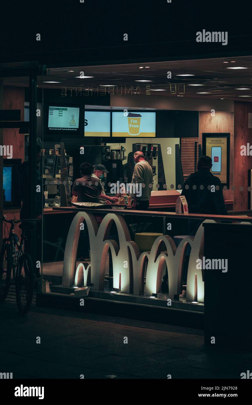 A vertical shot of a McDonald's restaurant in Middlesbrough, UK at night Stock Photo