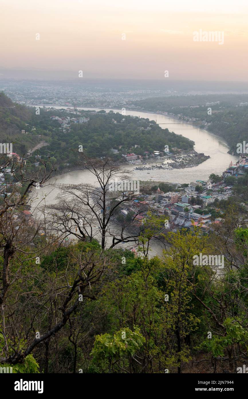 An aerial and vertical view of the Rishikesh and Ganges River in ...