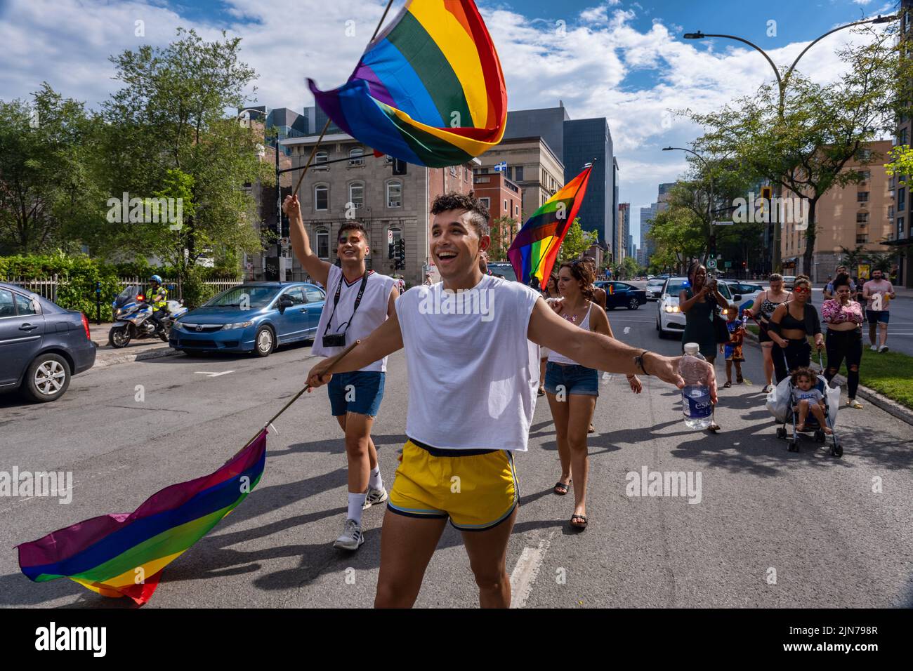 Montreal, CA - 7 August 2022: One young man takes part in spontaneous gay pride march after official pride parade was cancelled Stock Photo