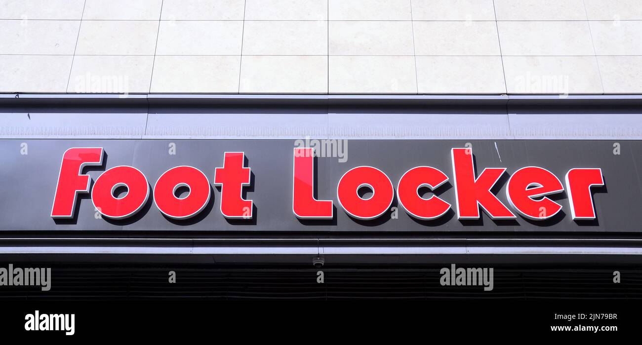 An exterior sign or signage or logo on the Foot Locker shop or store which sells shoes in central Manchester, United Kingdom, British Isles. Stock Photo