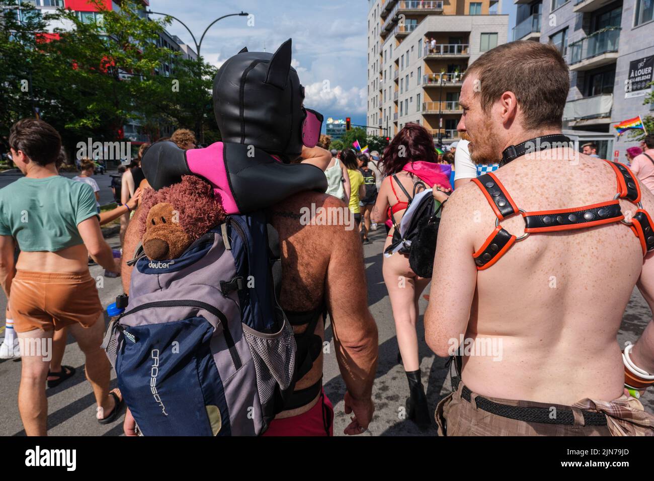 Montreal, CA - 7 August 2022: Two men take part in spontaneous gay pride march after official pride parade was cancelled Stock Photo