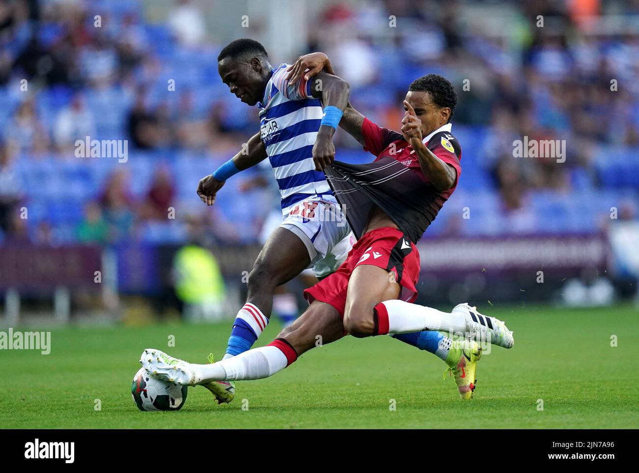 Reading's Basil Tuma (left) and Stevenage's Terence Vancooten battle for the ball during the Carabao Cup, first round match at the Select Car Leasing Stadium, Reading. Picture date: Tuesday August 9, 2022. Stock Photo