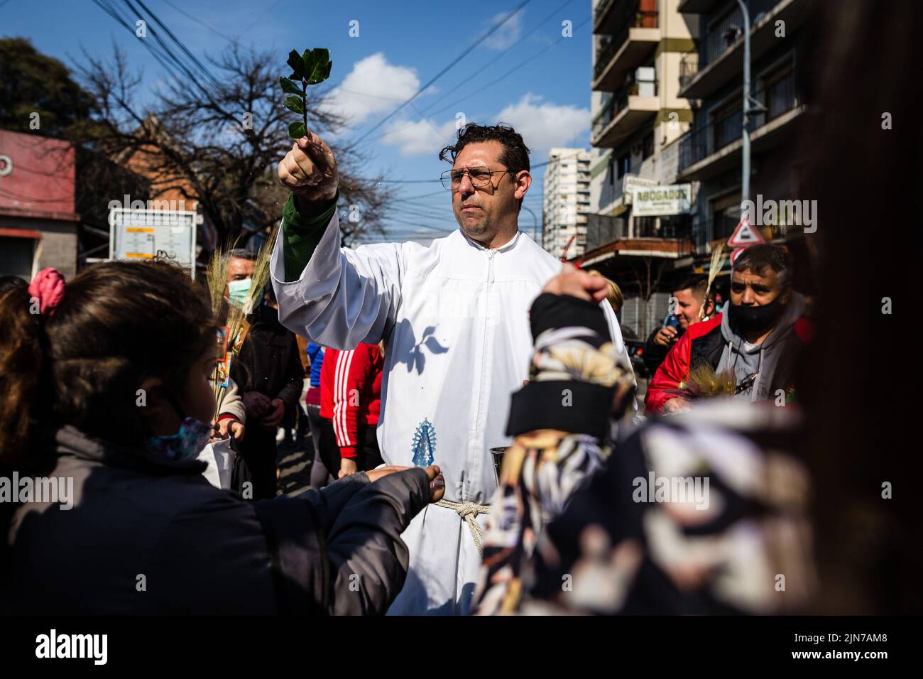 A girl holds the image of the Virgin of Lujan while a priest bencide her meters from the temple of San Cayetano. After two years of pandemic, the great feast of San Cayetano was celebrated again in the church Santuario San Cayetano, in the cosmopolitan neighborhood Liniers of the city of Buenos Aires. As every August 7, many faithful could touch the image and venerate the Saint of Labor to ask for bread, peace and sustenance. (Photo by Nacho Boullosa / SOPA Images/Sipa USA) Stock Photo
