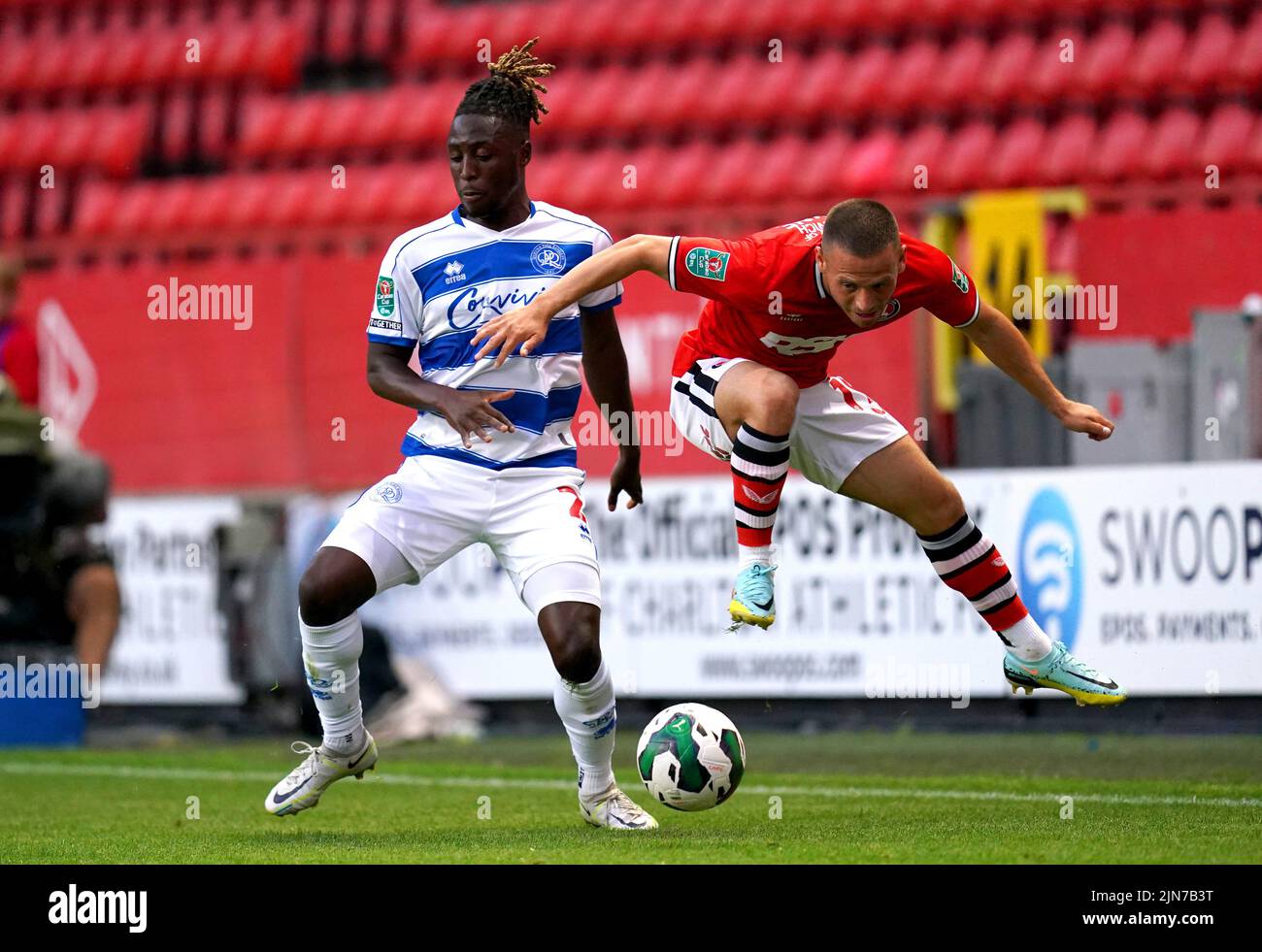 Queens Park Rangers' Osman Kakay (left) and Charlton Athletic's Jack Payne battle for the ball during the Carabao Cup, first round match at The Valley, London. Picture date: Tuesday August 9, 2022. Stock Photo