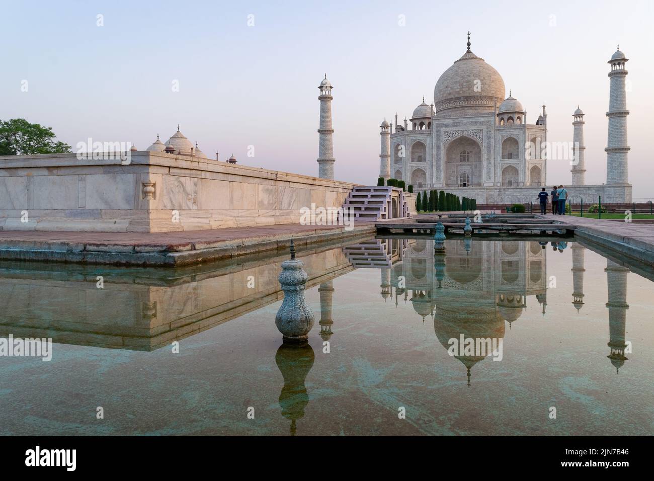 A shot of the Taj Mahal reflecting in the pool of water in front of the
