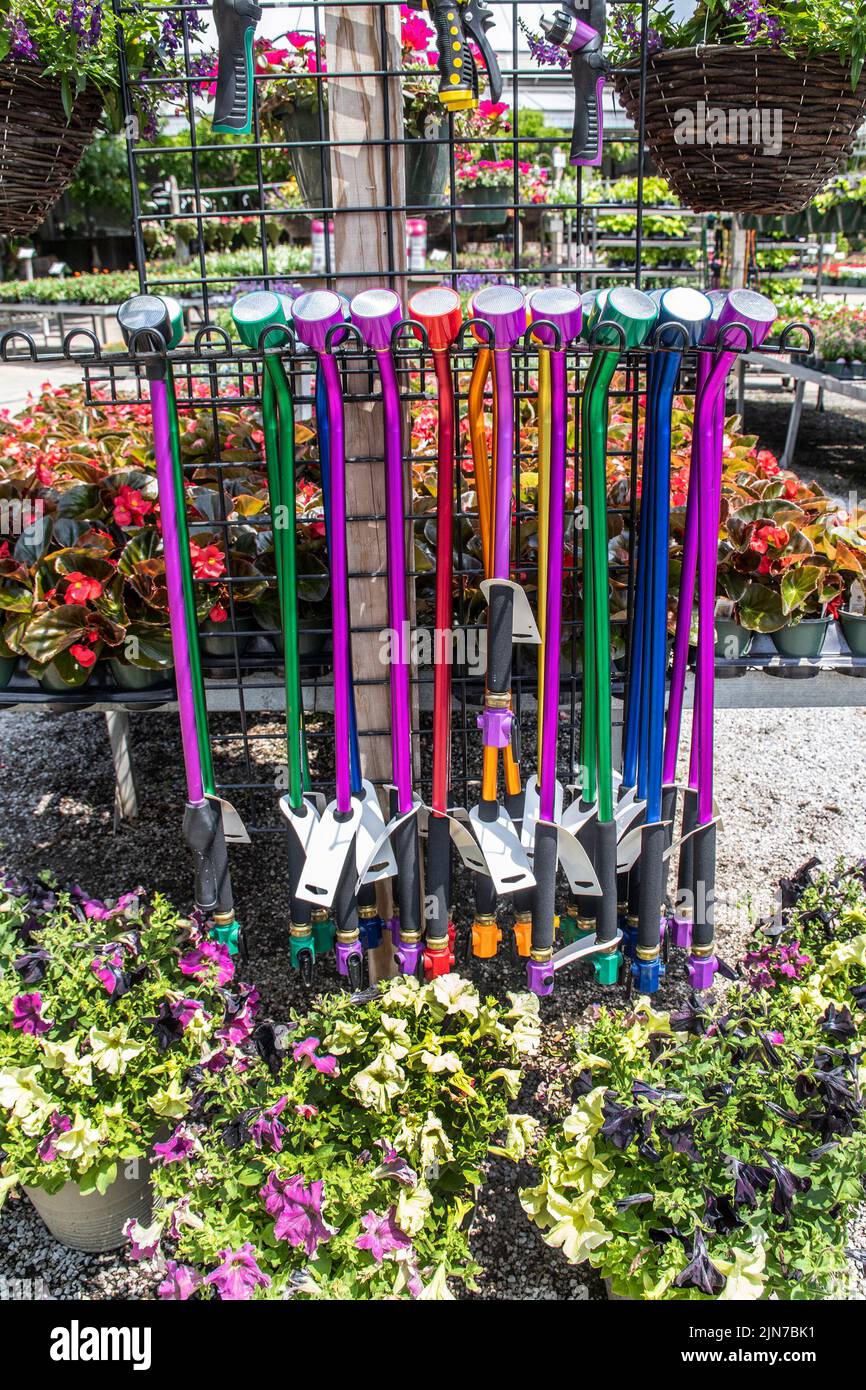 Summer garden watering wands and sprayers on display in garden center