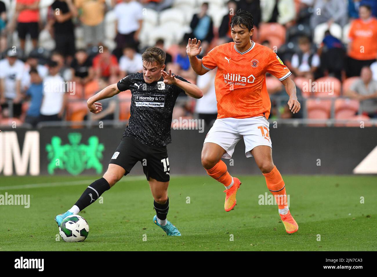 Blackpool, UK. 9th Aug, 2022. Robbie Gotts of Barrow Association Football Club tussles with Kenny Dougall of Blackpool Football Club during the Carabao Cup match between Blackpool and Barrow at Bloomfield Road, Blackpool on Tuesday 9th August 2022. (Credit: Eddie Garvey | MI News) Credit: MI News & Sport /Alamy Live News Stock Photo