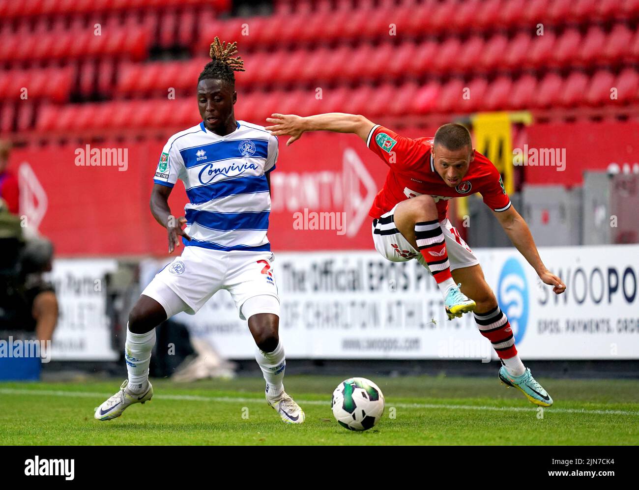 Queens Park Rangers' Osman Kakay (left) and Charlton Athletic's Jack Payne battle for the ball during the Carabao Cup, first round match at The Valley, London. Picture date: Tuesday August 9, 2022. Stock Photo
