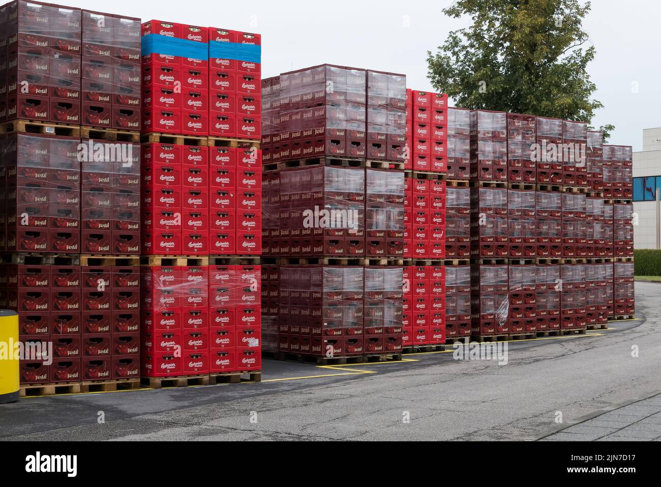 Ceske Budejovice, Czech Republic (6th August 2022) - Crates with bottles of Budweiser Budvar inside a court of the brewery plant Stock Photo