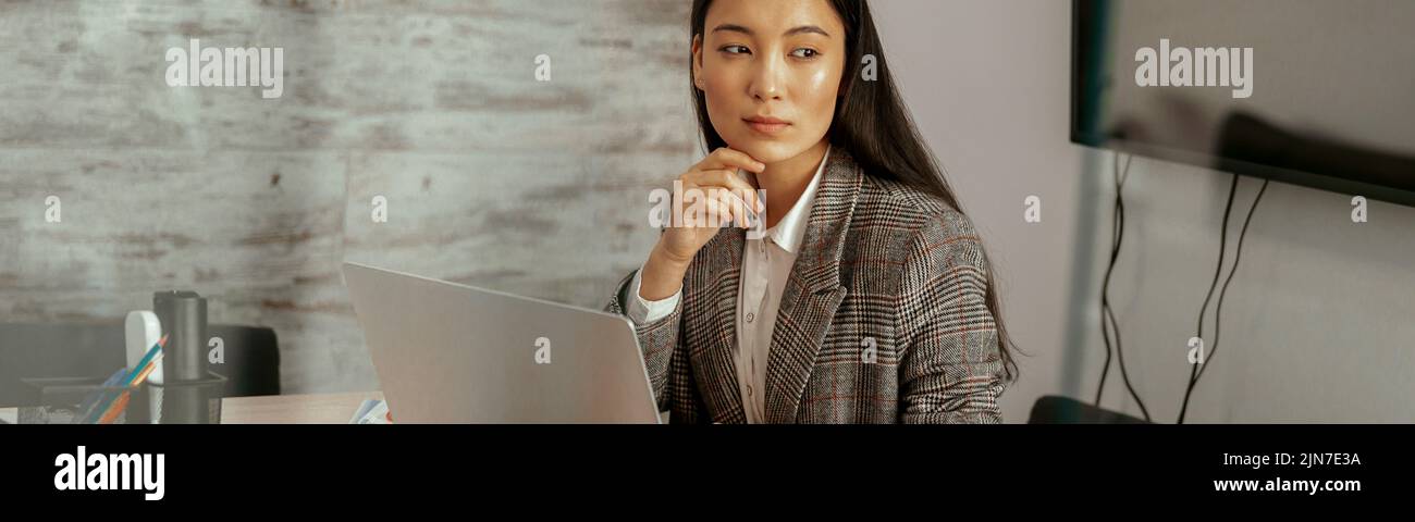Pretty asian business woman working laptop sitting in modern office and ...