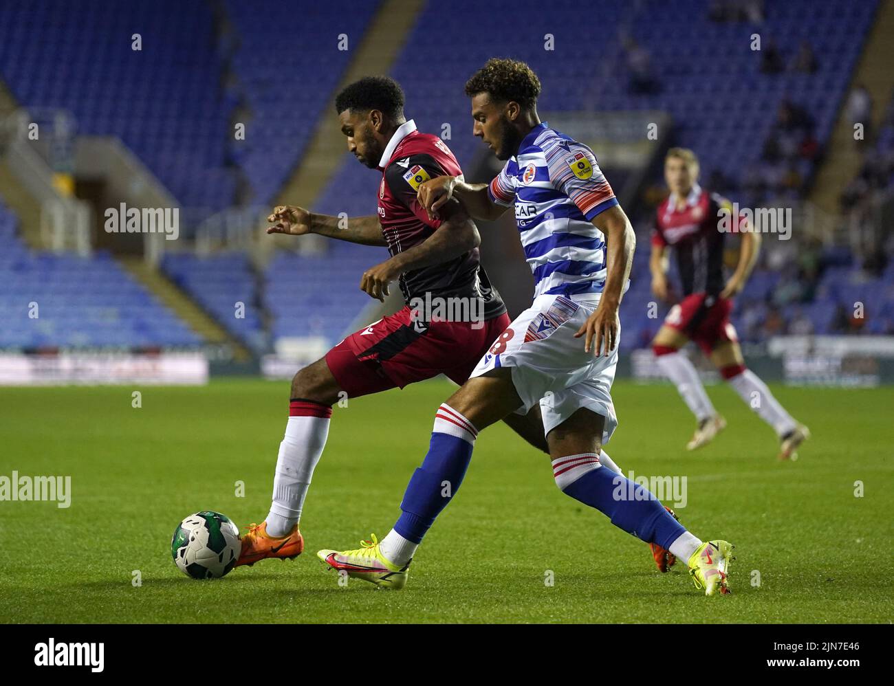 Stevenage's Jamie Reid (left) and Reading's Nesta Guinness-Walker battle for the ball during the Carabao Cup, first round match at the Select Car Leasing Stadium, Reading. Picture date: Tuesday August 9, 2022. Stock Photo