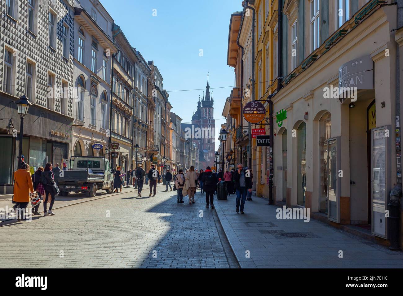 Krakow, Poland - 14 March, 2022: Tourists walking through Florianska ...