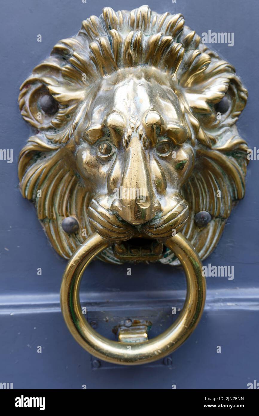European Vintage old metal wrought iron door knocker. Design detail. Paris. Stock Photo