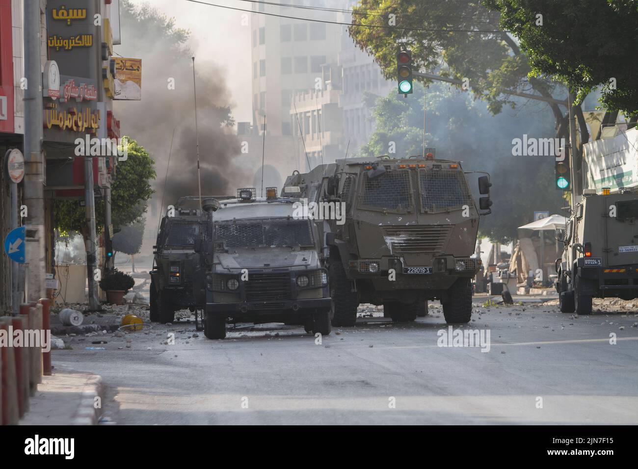 Nablus, Palestine. 02nd Aug, 2022. Military vehicles belonging to the Israeli army block the main street during the clashes with Israeli army forces after a raid in the Old City of Nablus in the occupied West Bank, the Palestinian Ministry of Health said that 3 Palestinians killed during the raid. Credit: SOPA Images Limited/Alamy Live News Stock Photo
