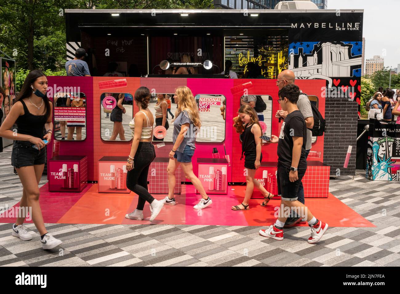 Visitors celebrate National Lipstick Day at a Maybelline pop-up branding activation in Hudson Yards in New York on Thursday, July 28, 2022. Visitors were treated to free product samples, a lip “touch up” and other attractions. Maybelline is a brand of L’Oreal. (© Richard B. Levine) Stock Photo