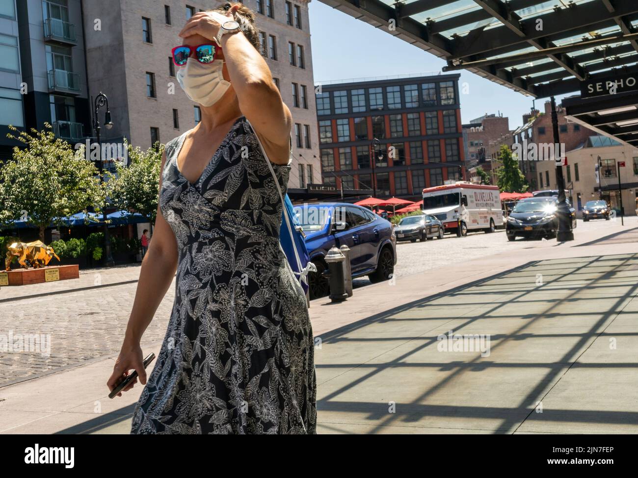 Visitors suffer through hot weather in the Meatpacking District in New York on Wednesday, August 3, 2022.  (© Richard B. Levine) Stock Photo