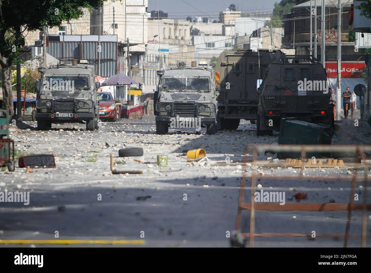 Military vehicles belonging to the Israeli army block the main street during the clashes with Israeli army forces after a raid in the Old City of Nablus in the occupied West Bank, the Palestinian Ministry of Health said that 3 Palestinians killed during the raid. (Photo by Nasser Ishtayeh / SOPA Images/Sipa USA) Stock Photo