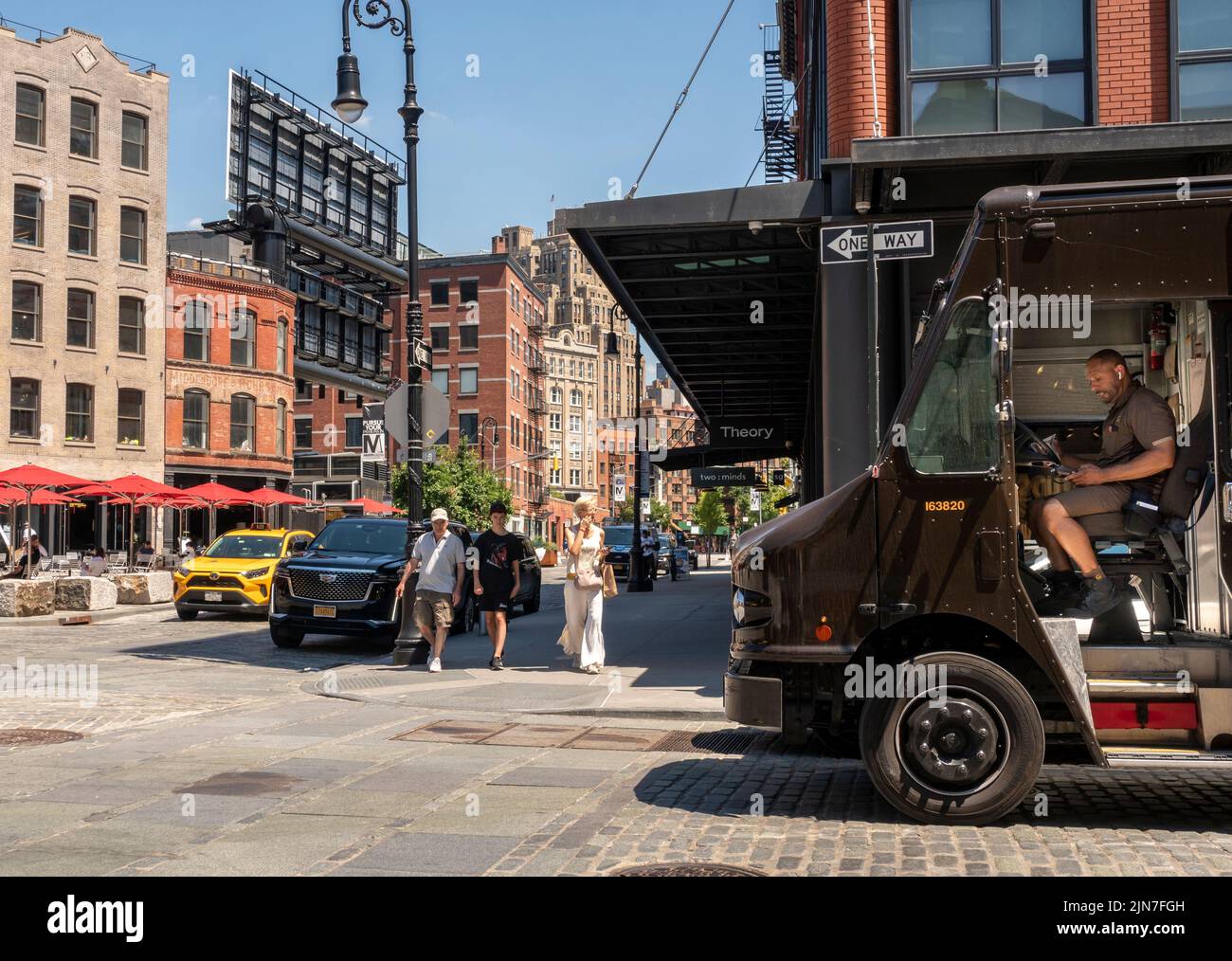 UPS driver and pedestrians suffer through hot weather in the Meatpacking District in New York on Wednesday, August 3, 2022.  (© Richard B. Levine) Stock Photo