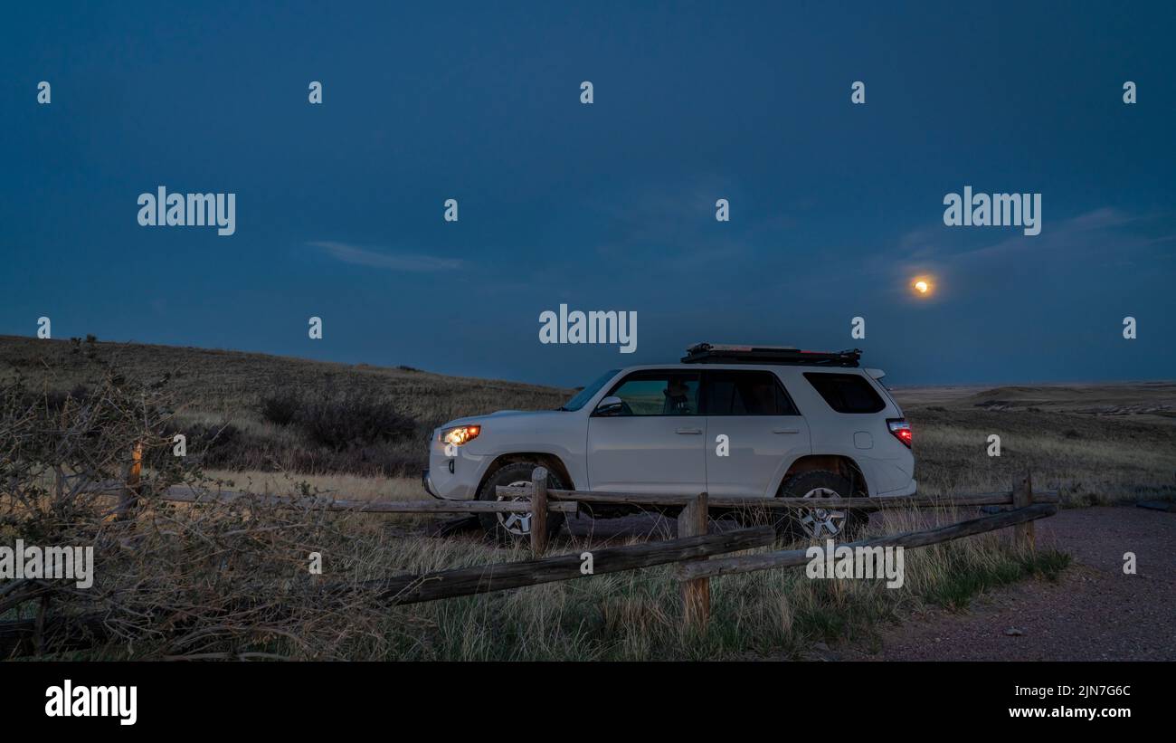 Fort Collins, CO, USA - May 15, 2022: Toyota 4Runner SUV at parked at a trailhead in Soapstone Prairie Natural Area in Colorado foothills, evening wit Stock Photo
