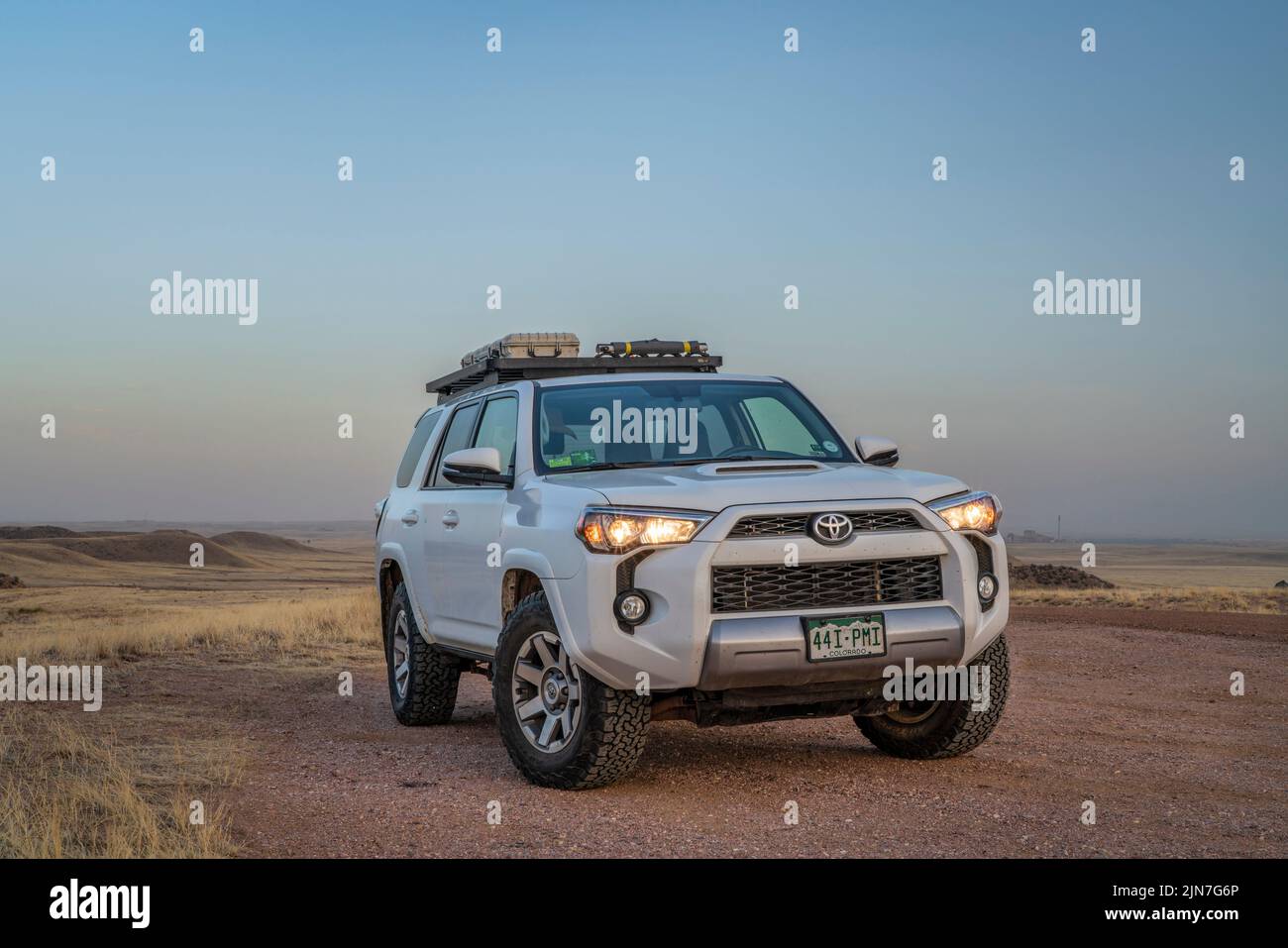 Fort Collins, CO, USA - April 16, 2022: Toyota 4Runner SUV at dusk parked at a trailhead in Soapstone Prairie Natural Area in Colorado foothills. Stock Photo