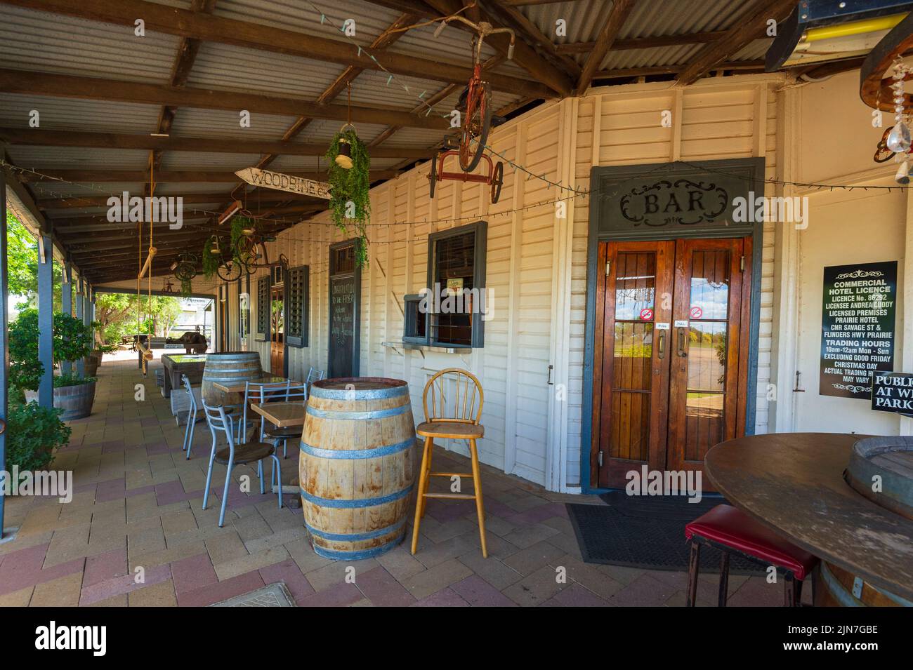 Verandah with barrels outside the Prairie Hotel, a renowned old Outback pub at Prairie, Queensland, QLD, Australia Stock Photo