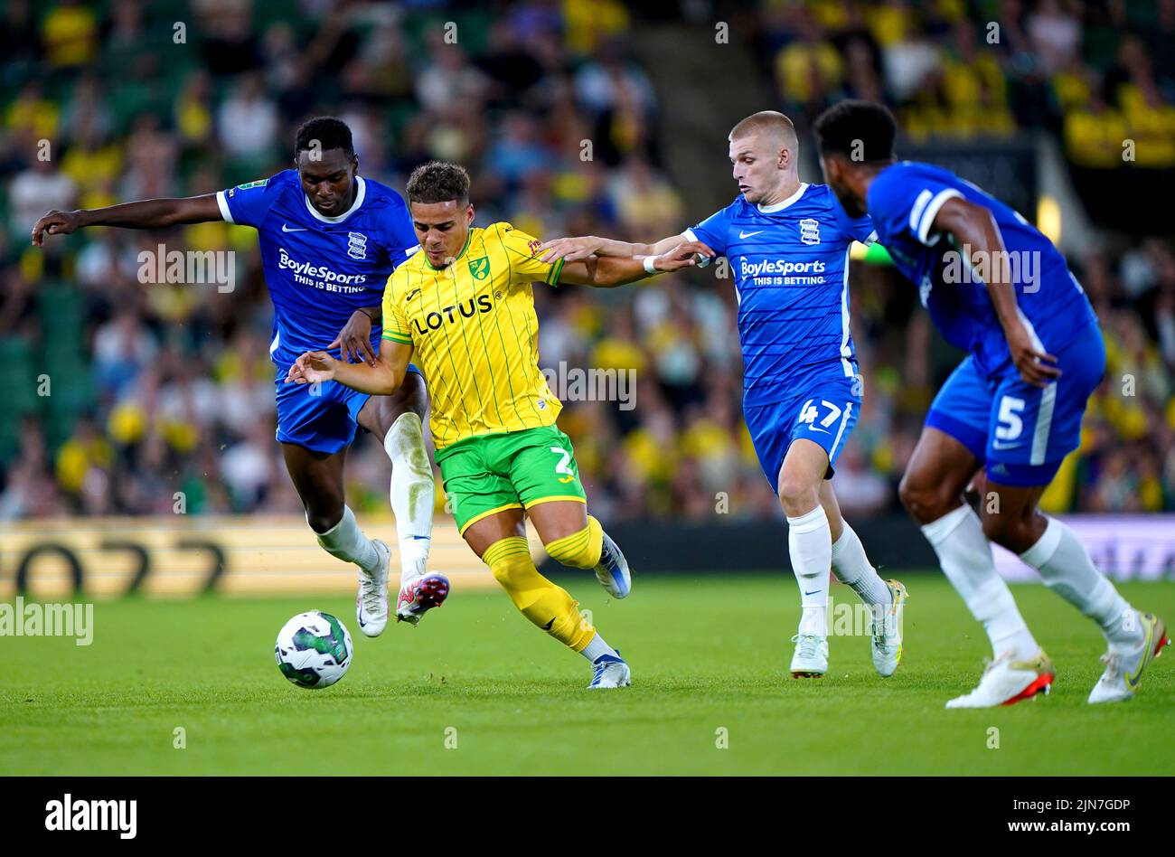 Norwich City's Max Aarons (second left) and Birmingham City's Ryan Stirk battle for the ball during the Carabao Cup, first round match at Carrow Road, Norwich. Picture date: Tuesday August 9, 2022. Stock Photo