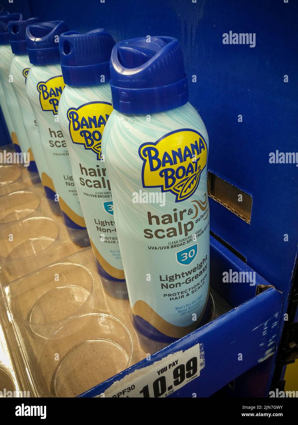 Bottles of Banana Boat brand Hair and Scalp Sunscreen Spray SPF 30 are seen on a store shelf in New York on Sunday, July 31, 2022. The product is the subject of a recall because of the presence of trace amounts of benzene.(© Richard B. Levine) Stock Photo