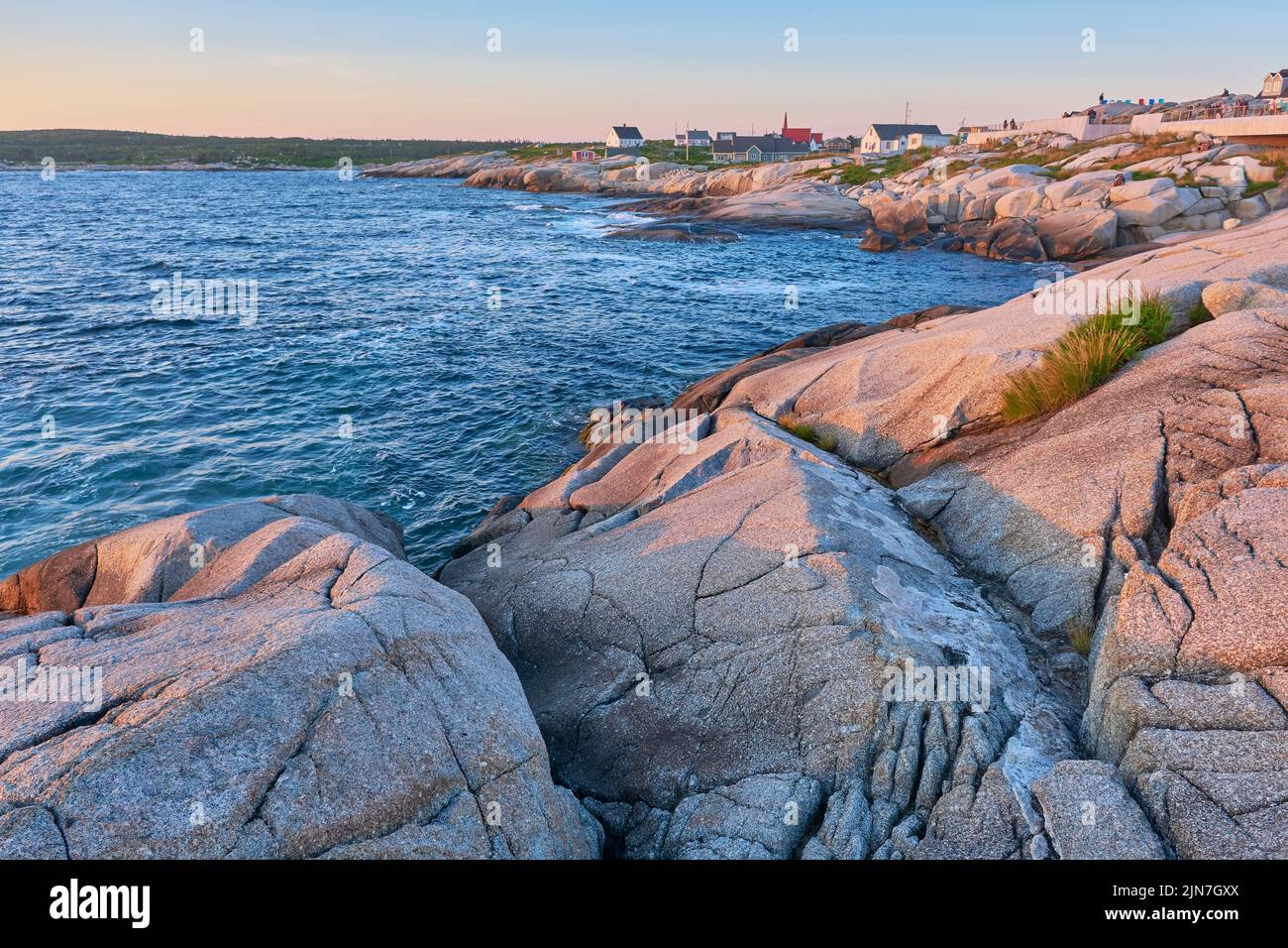 Photograph of Peggy's Cove Nova Scotia taken late in the afternoon just before sunset in summer. Stock Photo